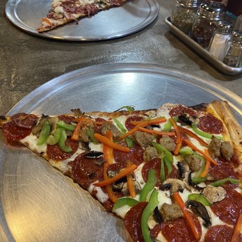 Mony’s Pizzeria - Mony's Pizza & Own created pizza slices - Pizza Near Me - Houston, Texas