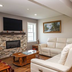 Blackstone - Basement Finished with hardwood floors, electric fireplace, & media center