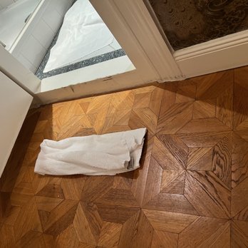 Henri Hotel - This is the step-up to the bathroom.  We rolled up this towel to save our toes.  Tripping was still a hazard. - Hotels Near Me - Berlin, BE
