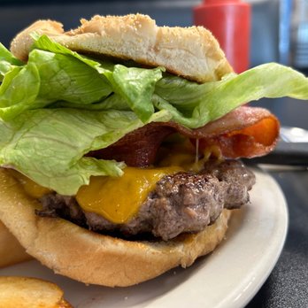 That One Place - a hamburger and fries on a plate - Burgers Near Me - Port Orchard, Washington That One Place - a hamburger and fries on a plate - Burgers Near Me - Port Orchard, Washington