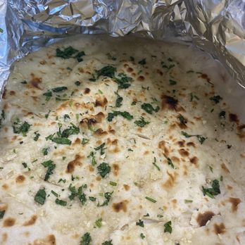 Famous Tandoori - Garlic naan - they use wheat flour so it's thinner but it was very good and fresh! - Pakistani Near Me - Frisco, Texas
