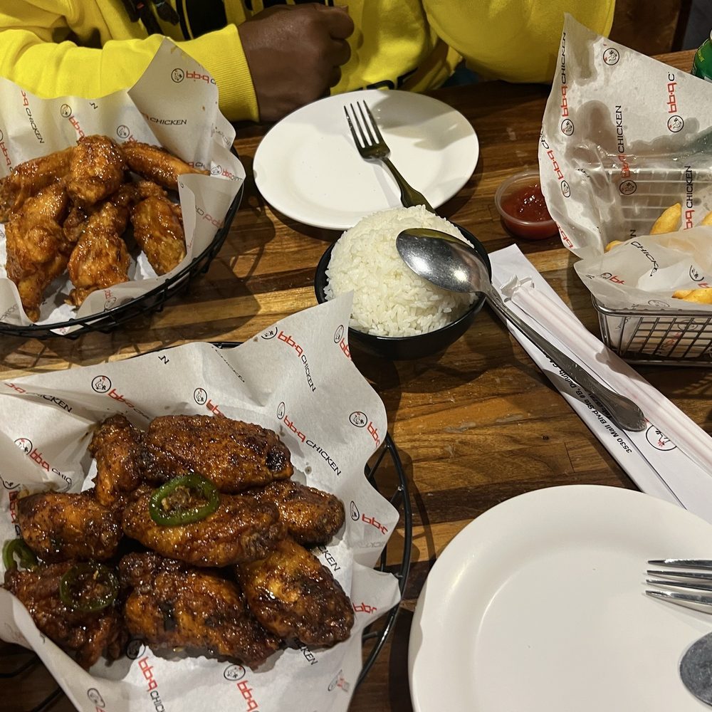 bb.q Chicken Duluth - Top left: Soy Garlic wings Bottom left: Gangnam Style Wings Steamed rice and an order of fries. - Korean Near Me - Duluth, Georgia