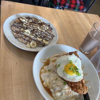 Eggsquisite Cafe - Spicy chicken and biscuits, with gravy and egg, and a drizzle of honey. So delicious! The pancake is banana Nutella, need I say more? - Breakfast & Brunch Near Me - Mansfield, Texas Eggsquisite Cafe - Spicy chicken and biscuits, with gravy and egg, and a drizzle of honey. So delicious! The pancake is banana Nutella, need I say more? - Breakfast & Brunch Near Me - Mansfield, Texas