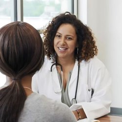 USA Fibroid Centers - USA Fibroid Center Doctor looking at patient