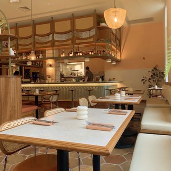 Uncle Wolfie’s Breakfast Tavern - a dining area with tables and chairs - Breakfast & Brunch Near Me - Milwaukee, Wisconsin