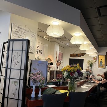 Sushi by Kazu - a woman sitting at a table - Sushi Bars Near Me - Freehold Township, New Jersey Sushi by Kazu - a woman sitting at a table - Sushi Bars Near Me - Freehold Township, New Jersey