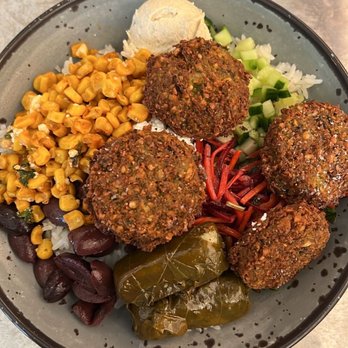 YAFO Kitchen - Rice, Hummus, Falafel, Cucumber, Grape Leaves, Corn, Beet and Carrot salad, and olives. - Mediterranean Near Me - Charlotte, North Carolina YAFO Kitchen - Rice, Hummus, Falafel, Cucumber, Grape Leaves, Corn, Beet and Carrot salad, and olives. - Mediterranean Near Me - Charlotte, North Carolina