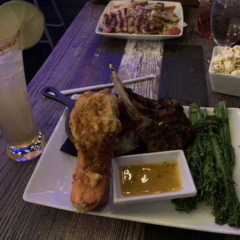 Aye Tea Elle Elevated Tapas - Surf and turf, broccolini and lamb chops, Cajun pasta, spicy margarita, vodka and cranberry - New American Near Me - College Park, Georgia