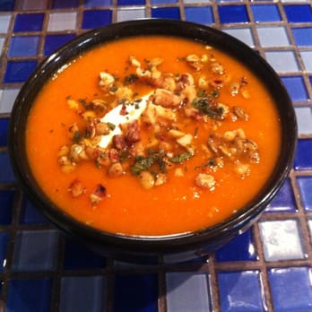 Cafe Organic - Carrot ginger soup topped with chopped almonds walnuts and Greek yogurt - New American Near Me - Fort Walton Beach, Florida Cafe Organic - Carrot ginger soup topped with chopped almonds walnuts and Greek yogurt - New American Near Me - Fort Walton Beach, Florida