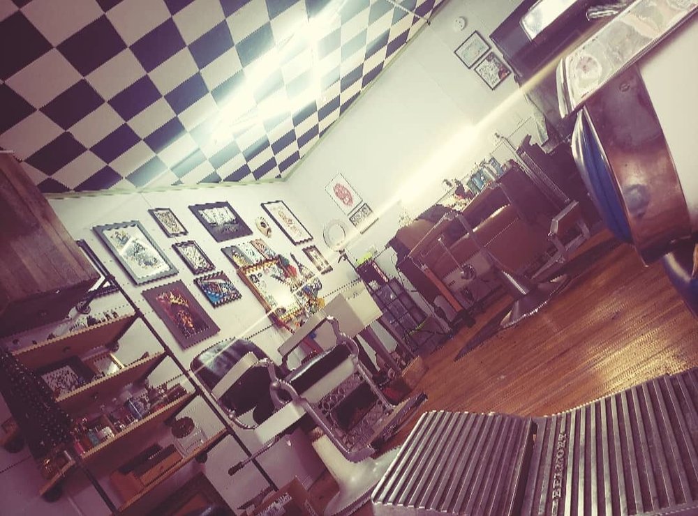 Southpaw Barbershop Logo