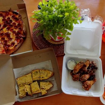 Pizza Rock - $29.95 Family Dinner to go from Pizza Rock, Brandon... 16" 2 top pizza, 10 wings, house salad, garlic bread and 2 ltr we picked up today! - Pizza Near Me - Brandon, Florida