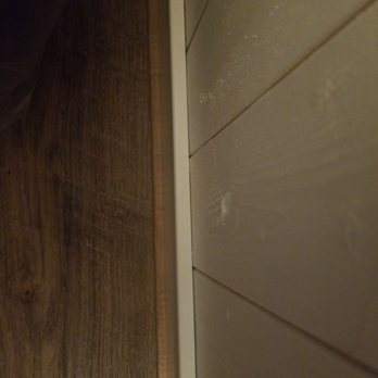 Cabinets To Go - That lighter brown is where we had to add flooring before installing trim...installer said trim would cover...Not! - Kitchen & Bath Near Me - Merrillville, Indiana