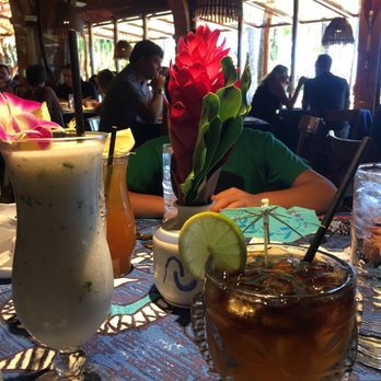 Beach At Mama's Fish House - Drinks for hubby and me & our son hiding behind the beautiful flower - Beaches Near Me - Paia, Hawaii Beach At Mama's Fish House - Drinks for hubby and me & our son hiding behind the beautiful flower - Beaches Near Me - Paia, Hawaii