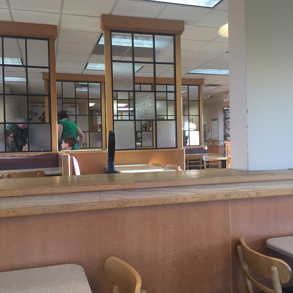 Wendy's - a woman sitting at a table in a restaurant - Burgers Near Me - La Grande, Oregon Wendy's - a woman sitting at a table in a restaurant - Burgers Near Me - La Grande, Oregon