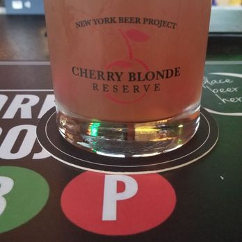 New York Beer Project - Cherry Blonde Reserve aged in Cherry Brandy barrels w/ bourbon soaked cherries 10 oz beer $7, Glass $10 Beer in Commemorative Glass $15 - Breweries Near Me - Lockport, New York