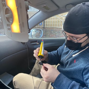 JSPrivateTech - After hiding the cables along the car and under an airbag, he pops the headlight places the mic in an open spot and glues it in. - Electronics Repair Near Me - E Elmhurst, New York