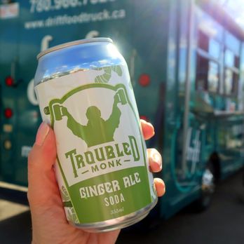 Drift Mobile Eatery - a hand holding a can of troubled nomad ginger ale - Food Trucks Near Me - Edmonton, Alberta Drift Mobile Eatery - a hand holding a can of troubled nomad ginger ale - Food Trucks Near Me - Edmonton, Alberta