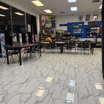 Duelers Guild - Tournament tables. Merch on the back wall. - Tabletop Games Near Me - Tracy, California