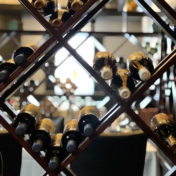 Lagar Restaurant - a rack of wine bottles - Portuguese Near Me - Union, New Jersey Lagar Restaurant - a rack of wine bottles - Portuguese Near Me - Union, New Jersey