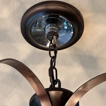 Bright Lights Electric - The base here fell down from the ceiling, including the bronze hardware. Cleaning it is not the problem, lack of proper installation is - Electricians Near Me - Henderson, Nevada