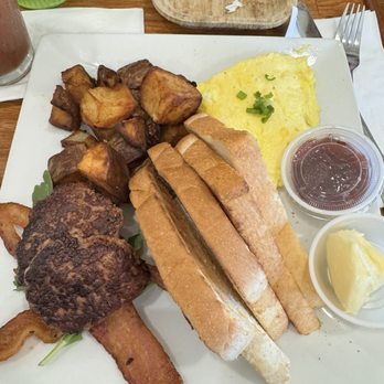 Heirloom Kitchen - Lil bit of eggs with burnt potatoes and burnt sausage, but lots of bread - Burgers Near Me - Stockton, California