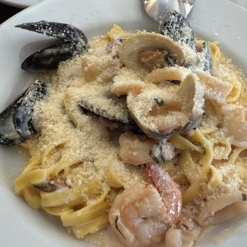 Maurizio's - Two spoonfuls of grated Parmesan cheese - Italian Near Me - Morgan Hill, California