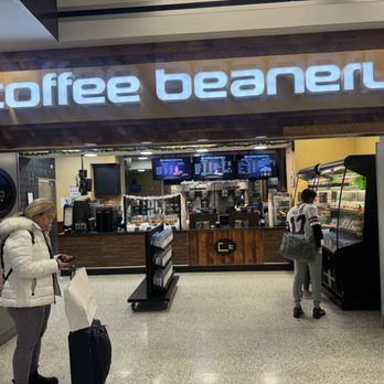 Coffee Beanery - Take Out Only - two people walking through a coffee beanery - Coffee & Tea Near Me - Buffalo, New York