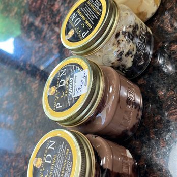 Famous Pudn - Flavors!!!  2 of them, the chocolate and the peach cobbler have bourbon in it! So good! Great dessert or anytime option! - Desserts Near Me - Murrieta, California