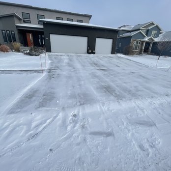 Kiss My Grass - a driveway covered in snow - Snow Removal Near Me Kiss My Grass - a driveway covered in snow - Snow Removal Near Me