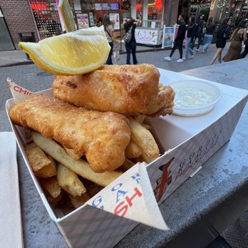 Gordon Ramsay Fish & Chips - Fish and chips box with tartar sauce and mango & curry sauce - Comfort Food Near Me - Las Vegas, Nevada Gordon Ramsay Fish & Chips - Fish and chips box with tartar sauce and mango & curry sauce - Comfort Food Near Me - Las Vegas, Nevada