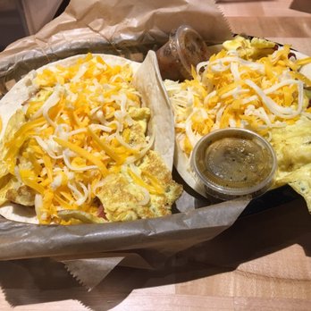 Torchy's Tacos - Breakfast taco with jalapeño sausage, egg and cheese for flour tortilla and Monk Special--bacon, egg, cheese and green chiles - Tex-Mex Near Me - Plano, Texas