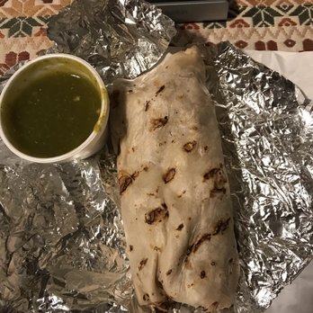 Las Asadas - a burrito wrapped in tin foil with a bowl of salsa - Mexican Near Me - Chicago, Illinois