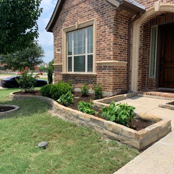 Pristine Landscaping and Lighting. - Side view of stonework done - Landscaping Near Me