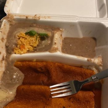 Los Tarascos - Two enchiladas, with beans that have spread all over into the rice and over the enchiladas. - Mexican Near Me - Fort Collins, Colorado Los Tarascos - Two enchiladas, with beans that have spread all over into the rice and over the enchiladas. - Mexican Near Me - Fort Collins, Colorado