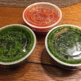 Green cilantro based medium sauce and the spicier (perhaps habanero?) red sauce. Green cilantro based medium sauce and the spicier (perhaps habanero?) red sauce.