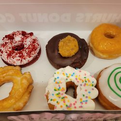 Hurts Donut - Top row - red velvet, German chocolate, regular glazed Bottom row - old fashioned, Birthday cake, key lime