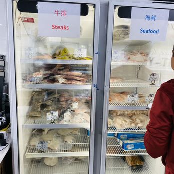 Marbelous NY - a woman standing in front of a refrigerator - Meat Shops Near Me - Flushing, New York Marbelous NY - a woman standing in front of a refrigerator - Meat Shops Near Me - Flushing, New York