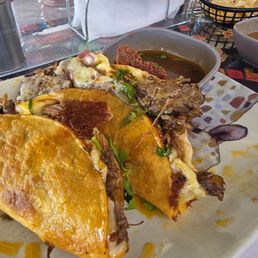 Carne Asad tacos with beef dipping sauce YUM. Carne Asad tacos with beef dipping sauce YUM.