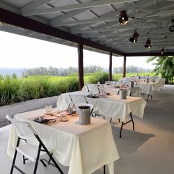 Naʻau - Whitehaven pop-up: The dining area is located on the lanai in the back of the main building.