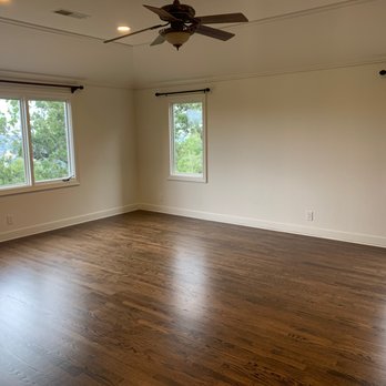 Elegant Floors - a large empty room with a ceiling fan - Flooring Near Me - Sunnyvale, California Elegant Floors - a large empty room with a ceiling fan - Flooring Near Me - Sunnyvale, California