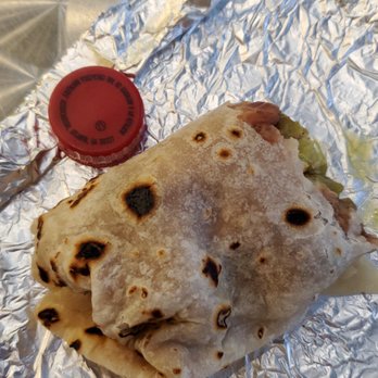 Rita's Burritos - Burrito half eaten compared to a bottle cap. - Mexican Near Me - Chandler, Arizona Rita's Burritos - Burrito half eaten compared to a bottle cap. - Mexican Near Me - Chandler, Arizona
