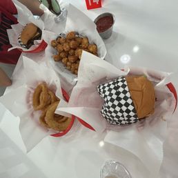 Classic Burger Onion rings Spicy Ketchup southwest burger and tater tots