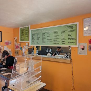 Taqueria Del Sol - a woman sitting at a counter - Mexican Near Me - Gualala, California Taqueria Del Sol - a woman sitting at a counter - Mexican Near Me - Gualala, California
