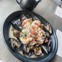 The Twin Otter Pub - Fisherman Stew mussels, haddock, calamari + prawns. rice + potato, cioppino broth