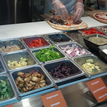 Blaze Pizza - Some of the toppings like kalamata olives, zucchini,  artichoke, red peppers, roasted and minced garlic ect. - Salad Near Me - Davie, Florida
