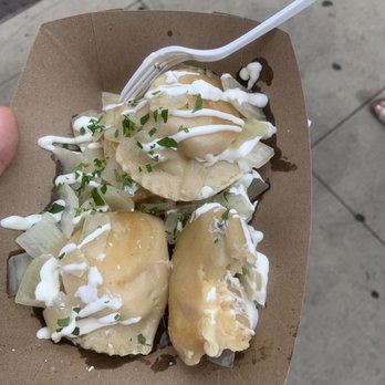 Babushka Pierogies Window - a person holding a fork - Ukrainian Near Me - Cincinnati, Ohio Babushka Pierogies Window - a person holding a fork - Ukrainian Near Me - Cincinnati, Ohio