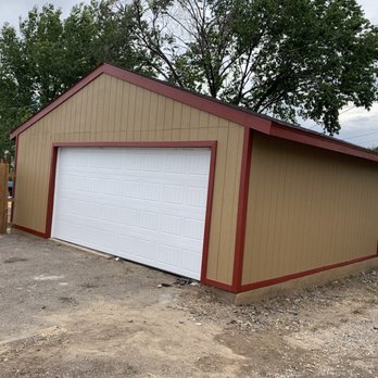Big E’s Contracting - a garage with a white garage door - Masonry/Concrete Near Me Big E’s Contracting - a garage with a white garage door - Masonry/Concrete Near Me