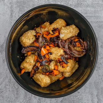 Fat Rigo - Rigo Tots. Topped with grilled onions and bell peppers. - Breakfast & Brunch Near Me