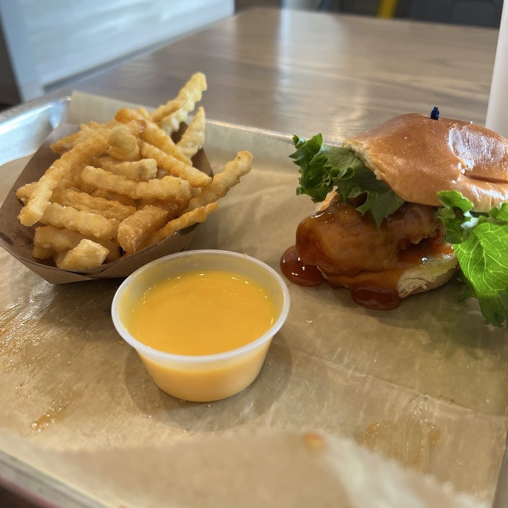 Hot Honey Chicken, crinkle fries, Cheddar Cheese Sauce Hot Honey Chicken, crinkle fries, Cheddar Cheese Sauce