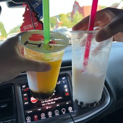 WIN Bubble Tea - Nolensville - Mango slushy with tapioca and coconut slushy with tapioca .